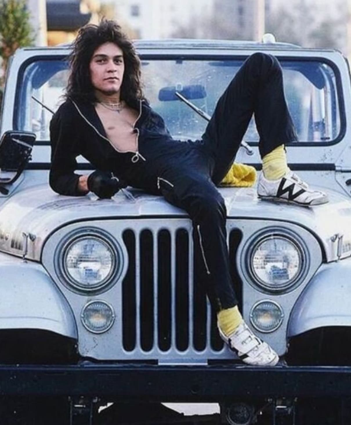 “Eddie Van Halen (early 80s) with his CJ-5 Jeep Renegade and rocking a pair of Payless Pro Wings.” 